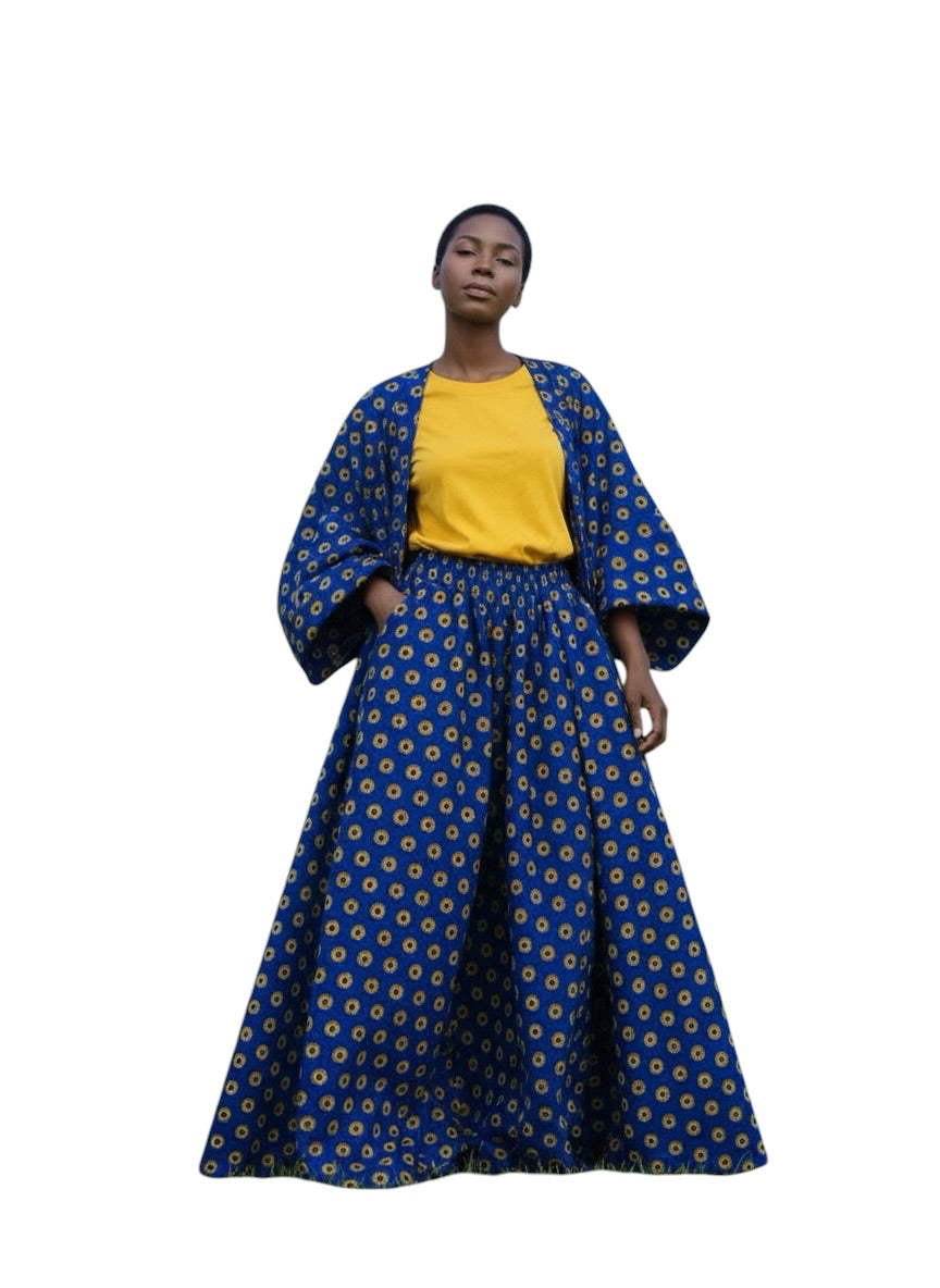 Cobalt blue Ankara-style print fabric swatch with yellow and maroon medallion pattern